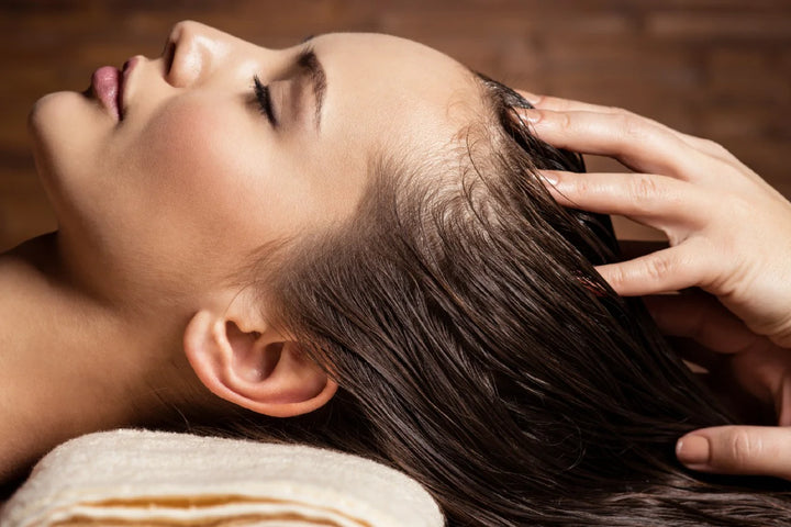 A woman enjoying hair spa | hair spa benefits
