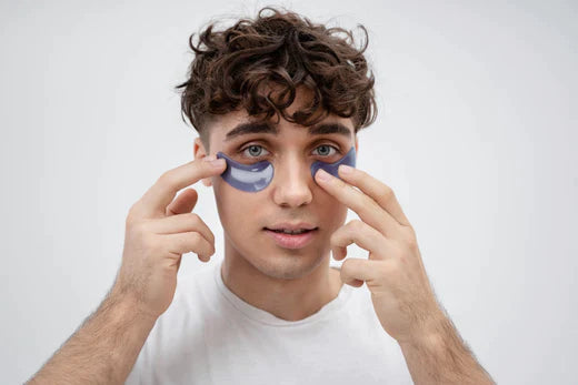 Man holding under eye sheet | under eye cream benefits
