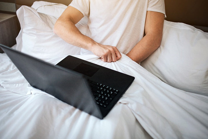Man using laptop and masturbating | Does Masturbation Cause Weight Loss