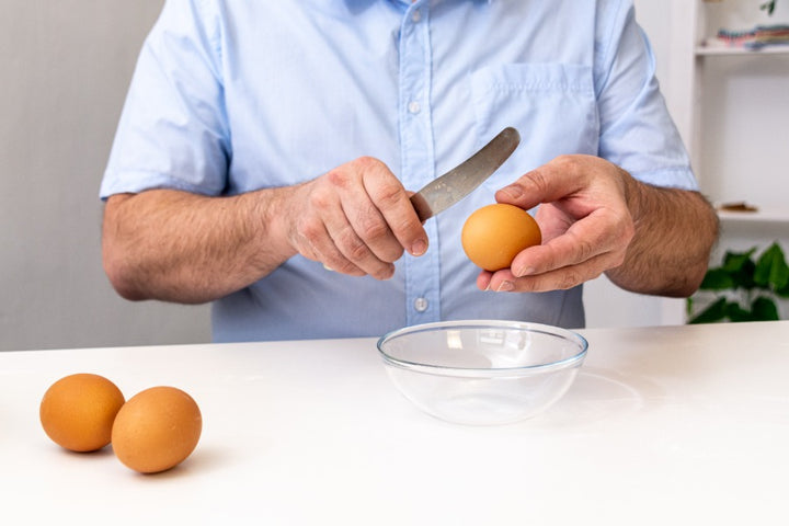 egg | man breaking egg | How to use eggs to prevent hair loss? | egg for hair loss
