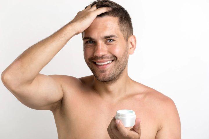 Man applying hair cream | hair gel side effects