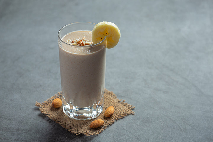 Glass of banana smoothie | banana shake benefits