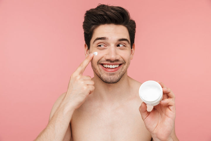 a man applying cream on his face to protect his skin from irritants.