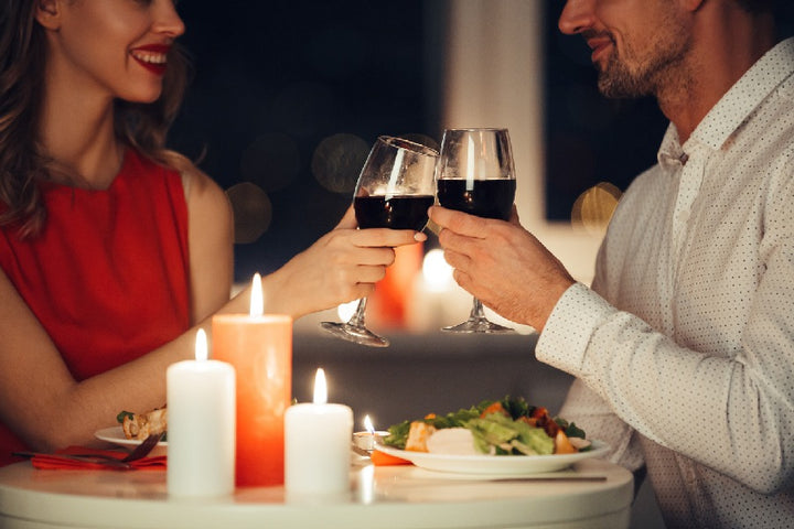 a couple enjoying candle light dinner