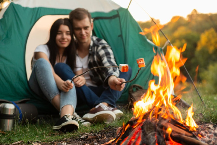 couple enjoying bonfire